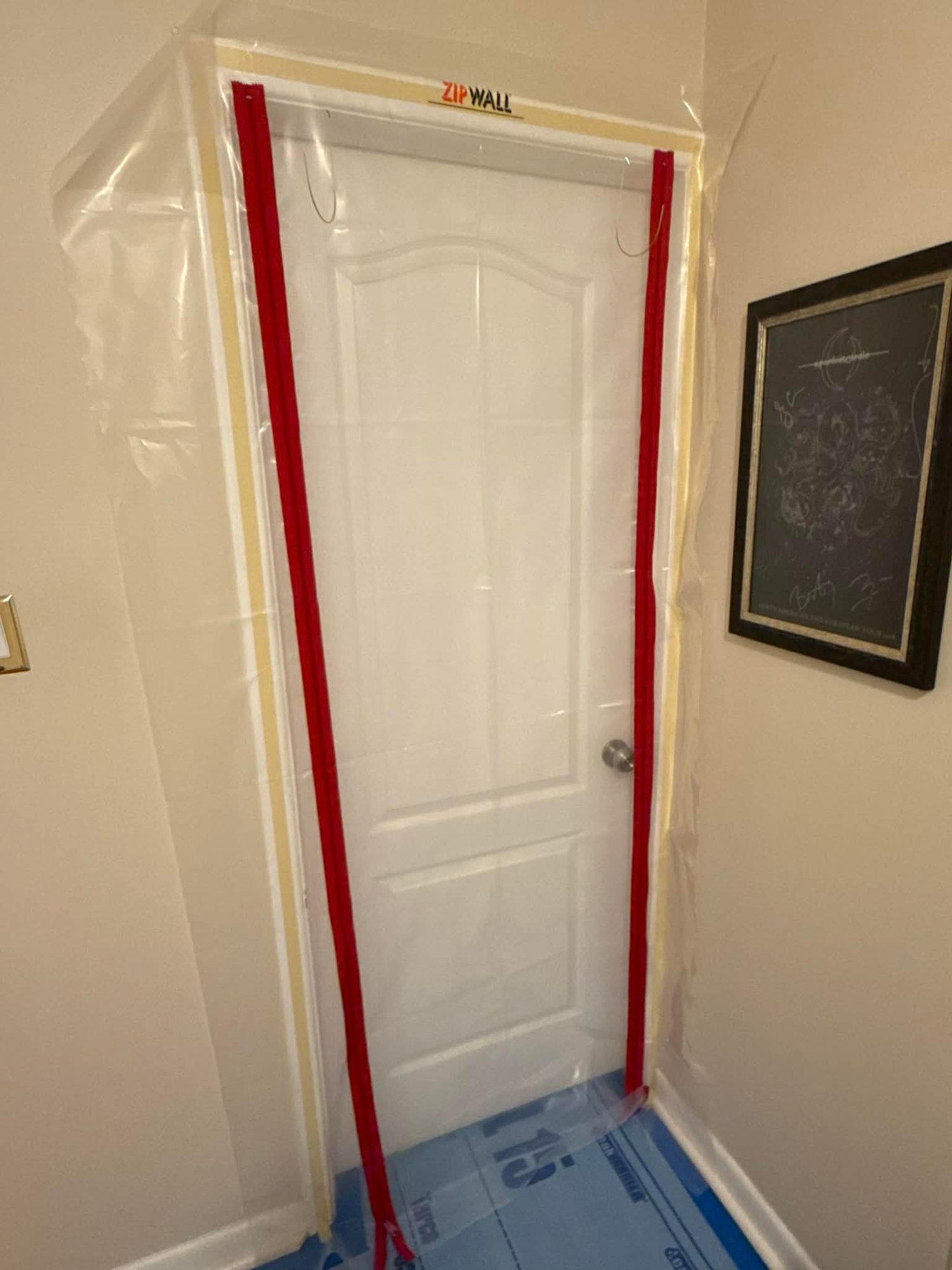 Airtight ZipWall dust barrier and professional floor masking setup by Carlson Painting Co. in Atlanta, ensuring a clean-site interior painting experience.8 Airtight ZipWall dust barrier and professional floor masking setup by Carlson Painting Co. in Atlanta, ensuring a clean-site interior painting experience.8