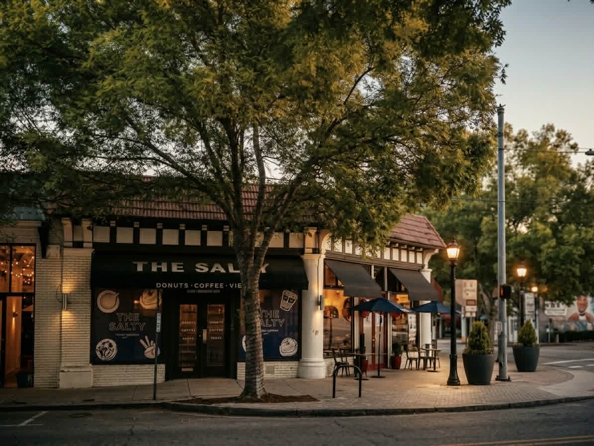 A charming commercial storefront in a historic Atlanta neighborhood featuring classic architecture, outdoor seating, and warm evening lighting in a high-end local service area. A charming commercial storefront in a historic Atlanta neighborhood featuring classic architecture, outdoor seating, and warm evening lighting in a high-end local service area.